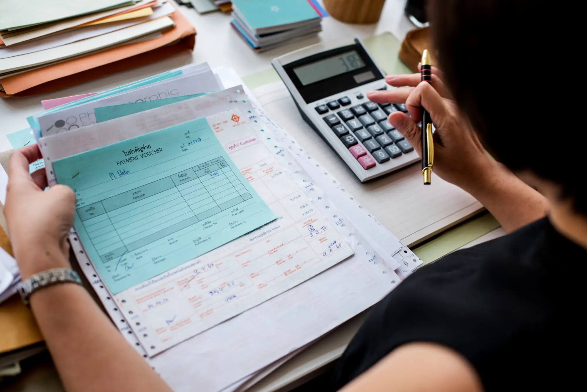 woman working through paperwork