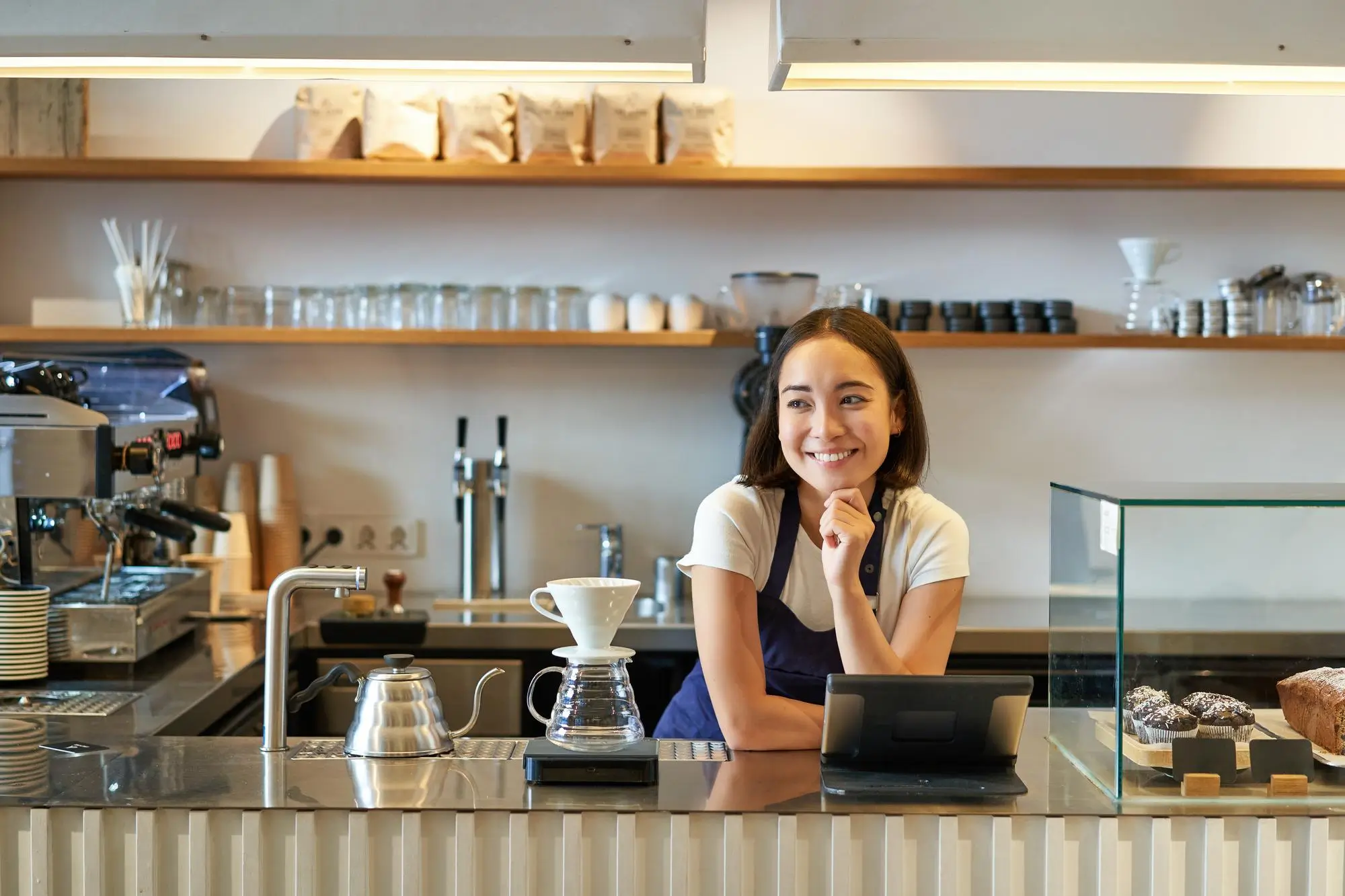 Cafe and small business smiling asian barista